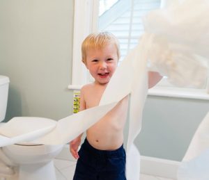 Kid playing with toilet paper
